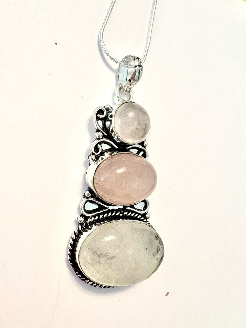 2 1/2 inch, 3 Rose Quartz, 925 marked pendant on a silver chain.